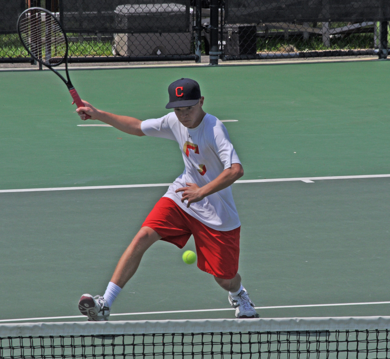 Jackson Scmidt of Lubbock Coronado High School sends the ball back to his opponents from Tyler Lee High School in the Boys' Doubles quarterfinals. 