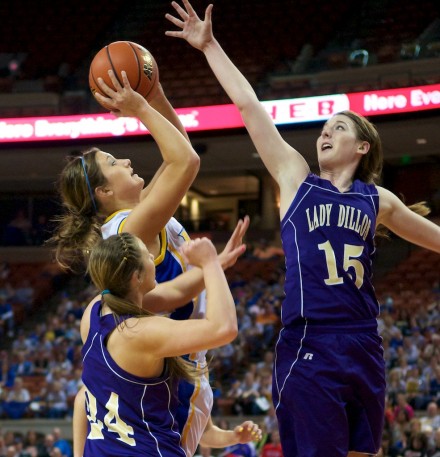 Amy Henard of Brock goes up for a shot against Haylee Oliver (right) and Jaena Edwards (left) from San Saba.  For the third year in a row, Brock won the 2A UIL State Championship.